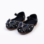 Black glitter party shoes for girls with blue stone butterfly design