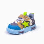 Side view of comfortable children's shoes with velcro strap and neon star