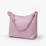 Trendy blush pink shoulder bag with soft structure and zipper