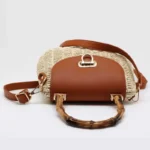 Top view of women's cream white retro woven handbag showing bamboo handle and strap in Bangladesh