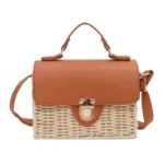 Women's beige handmade rattan straw crossbody bag with brown faux-leather flap in Bangladesh