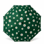 Dark green daisy print compact 12-rib travel umbrella.
